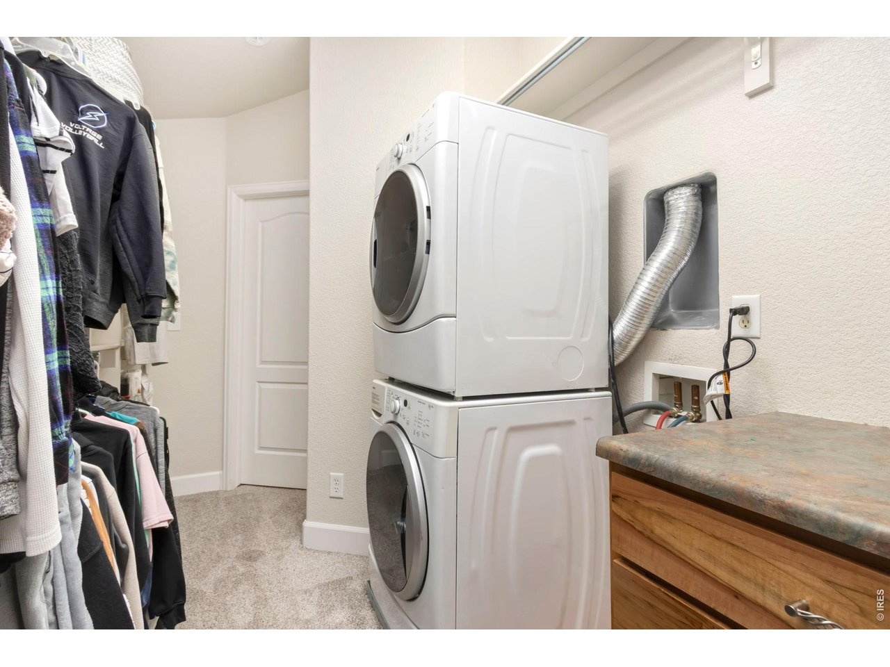 Primary closet with second entrance so laundry can be accessed from main living area