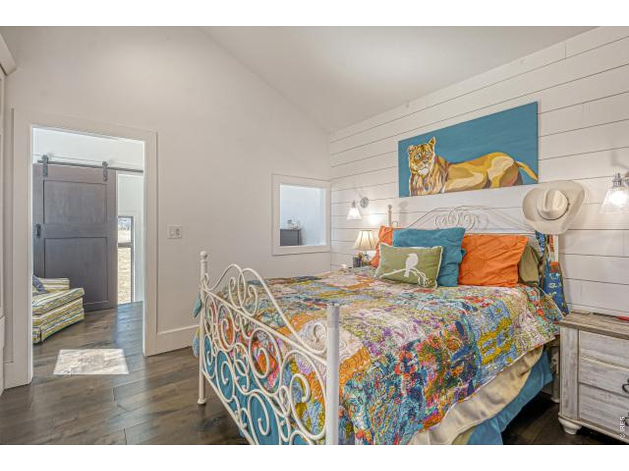 Upstairs bedroom and sitting area with balcony