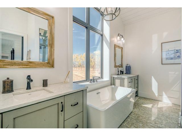 Property Photo 22 Primary bathroom with dual vanities and soaker tub