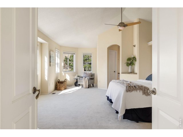 Property Photo 27 French doors welcome you into the spacious owners' retreat on the upper level.