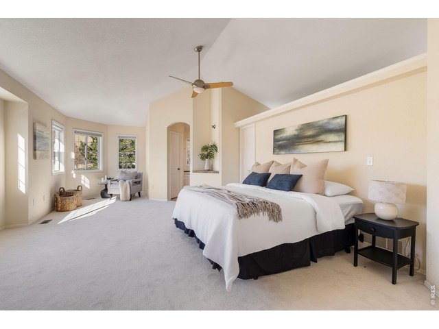 Property Photo 28 The luxurious primary suite, filled with natural light, a cozy reading nook and spacious walk-in closet.