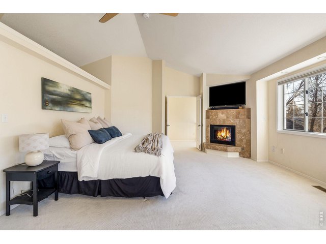 Property Photo 29 Soaring ceilings and a beautiful gas fireplace for cozy evenings.