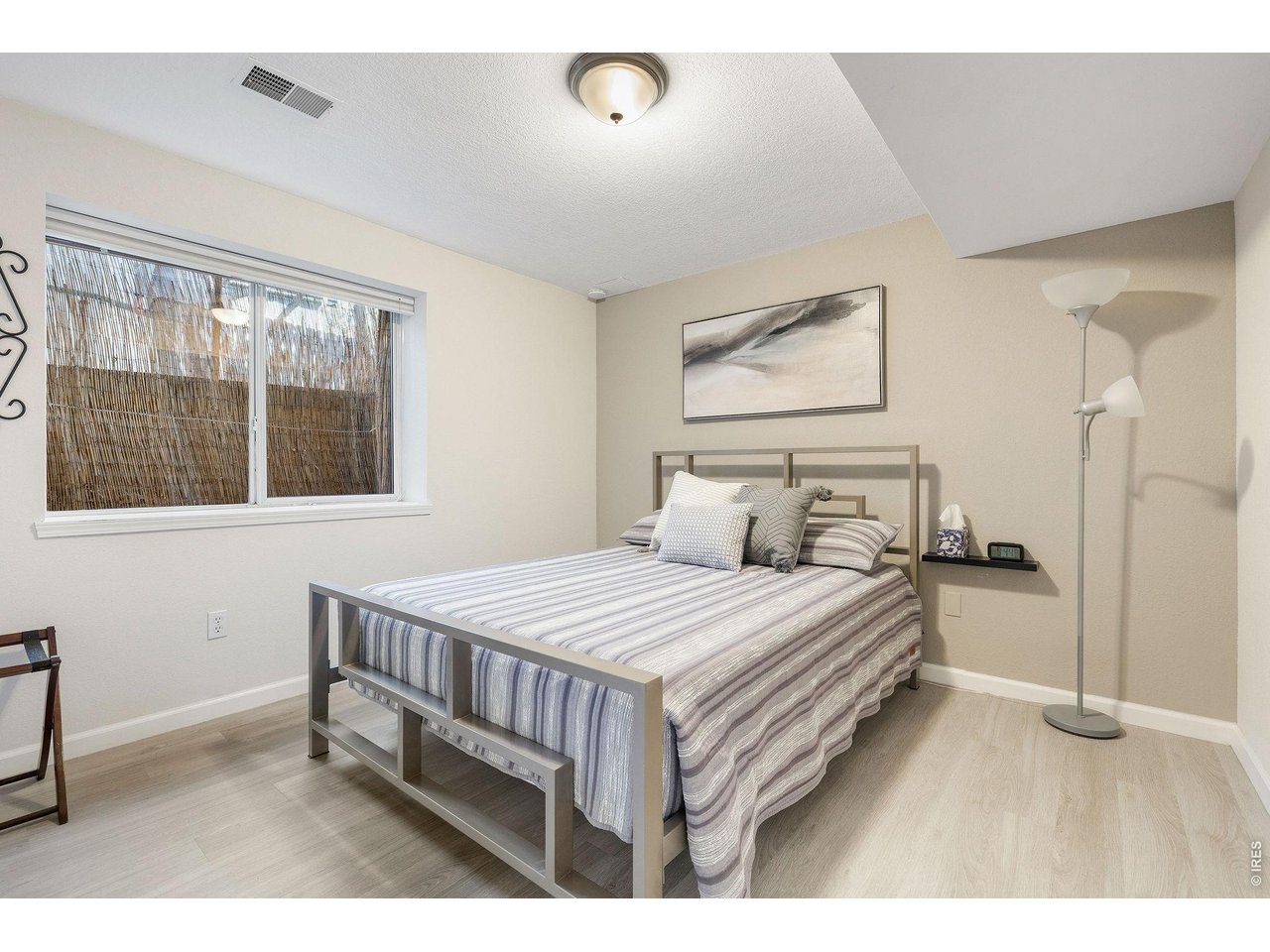 Lower level guest bedroom with a spacious closet and guest bathroom.