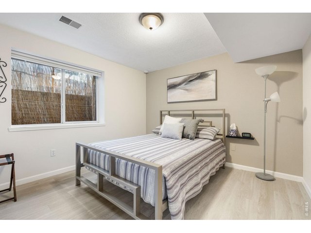 Property Photo 41 Lower level guest bedroom with a spacious closet and guest bathroom.