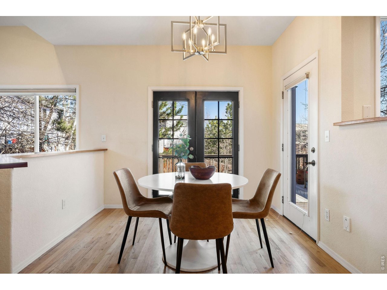 Designer pendant lighting frames a chic breakfast nook. 