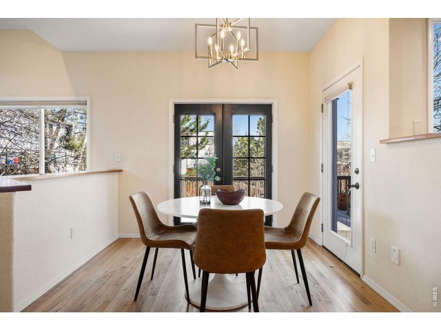 Property Photo 19 Designer pendant lighting frames a chic breakfast nook. 