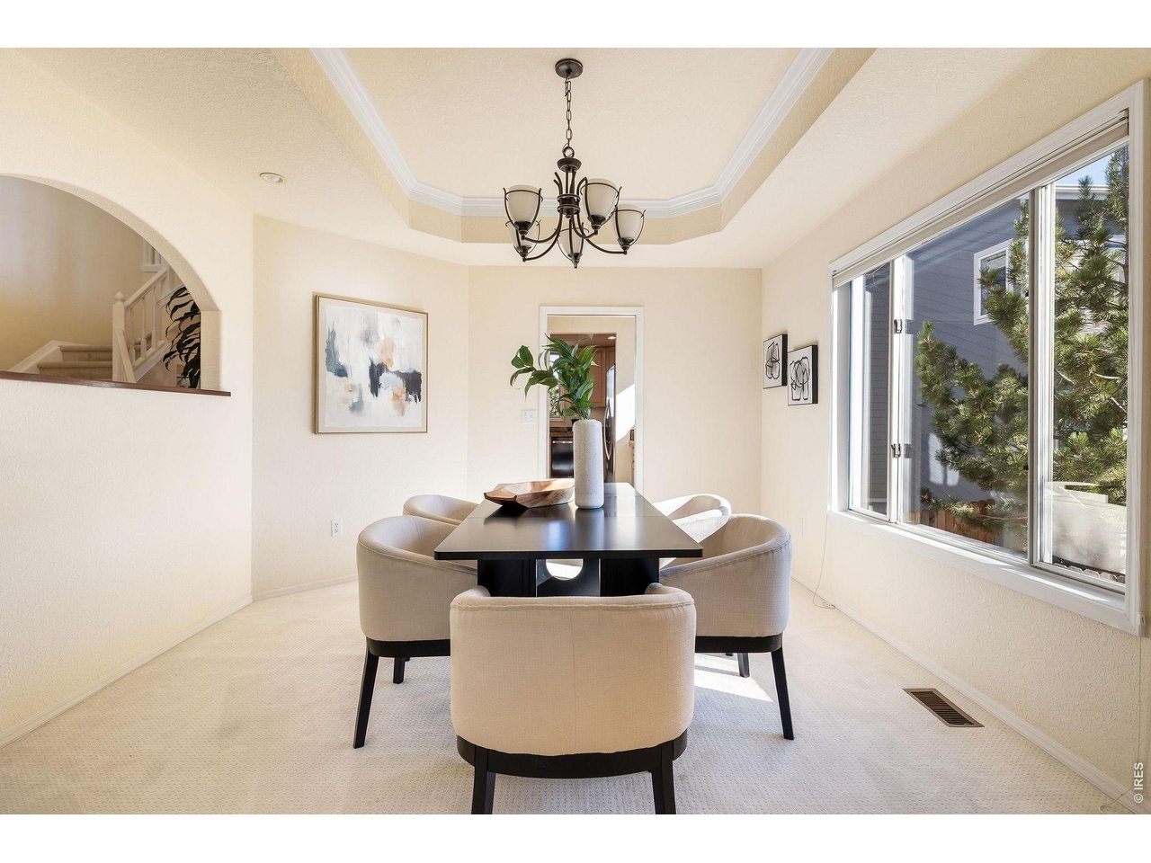 Glowing dining room with direct access to the butler pantry and gourmet kitchen.