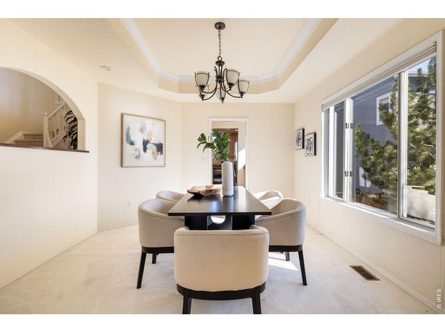 Property Photo 12 Glowing dining room with direct access to the butler pantry and gourmet kitchen.