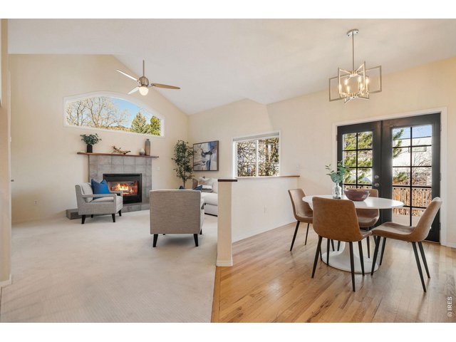 Property Photo 18 The kitchen flows seamlessly into a dining space and family room with foothill views!