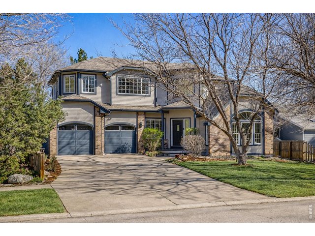 Property Photo 42 Spacious two car garage and wide driveway for ease of parking and hosting. (Image enhanced with Ai to show greener grass)