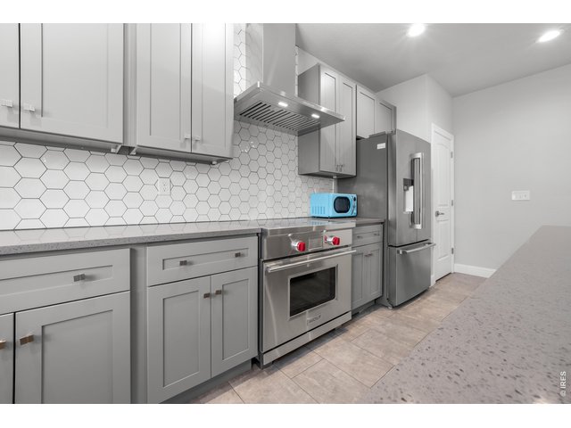 Property Photo 9 tremendous kitchen appliances Wolf induction range 