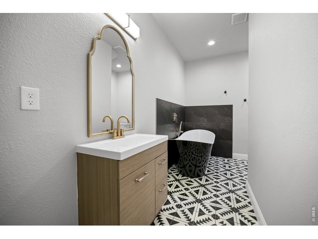 Property Photo 32 downstairs bath with luxury tub 