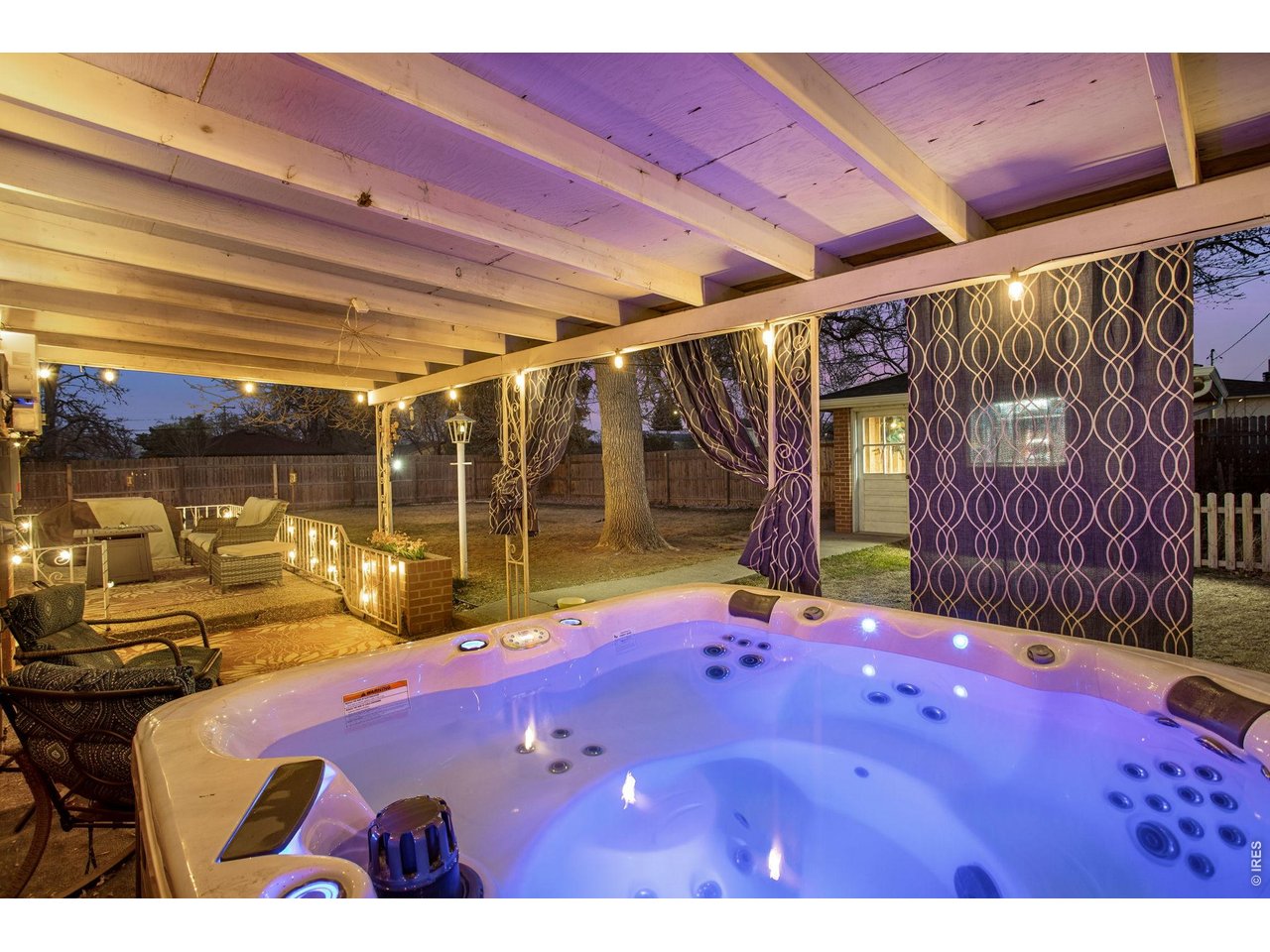 Backyard: Enjoy your own private escape and soak your cares away in the included hot tub.