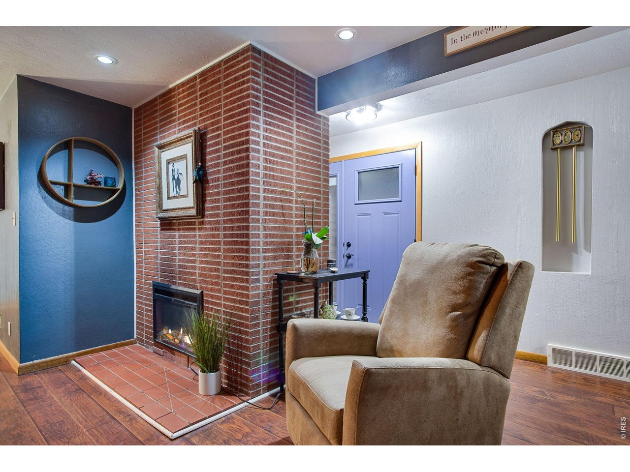 Living Room: They don't make them like this anymore. The blue front door is new as of 2025 and has a nice storm door so you can let even more light in.