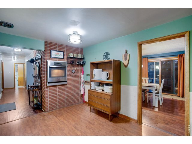 Property Photo 7 Kitchen: Oven is built into the side of the classic 50's style brick fireplace that is in the living room.