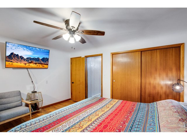 Property Photo 19 Primary: Original, quality wood doors. There is another closet behind the bedroom door.
