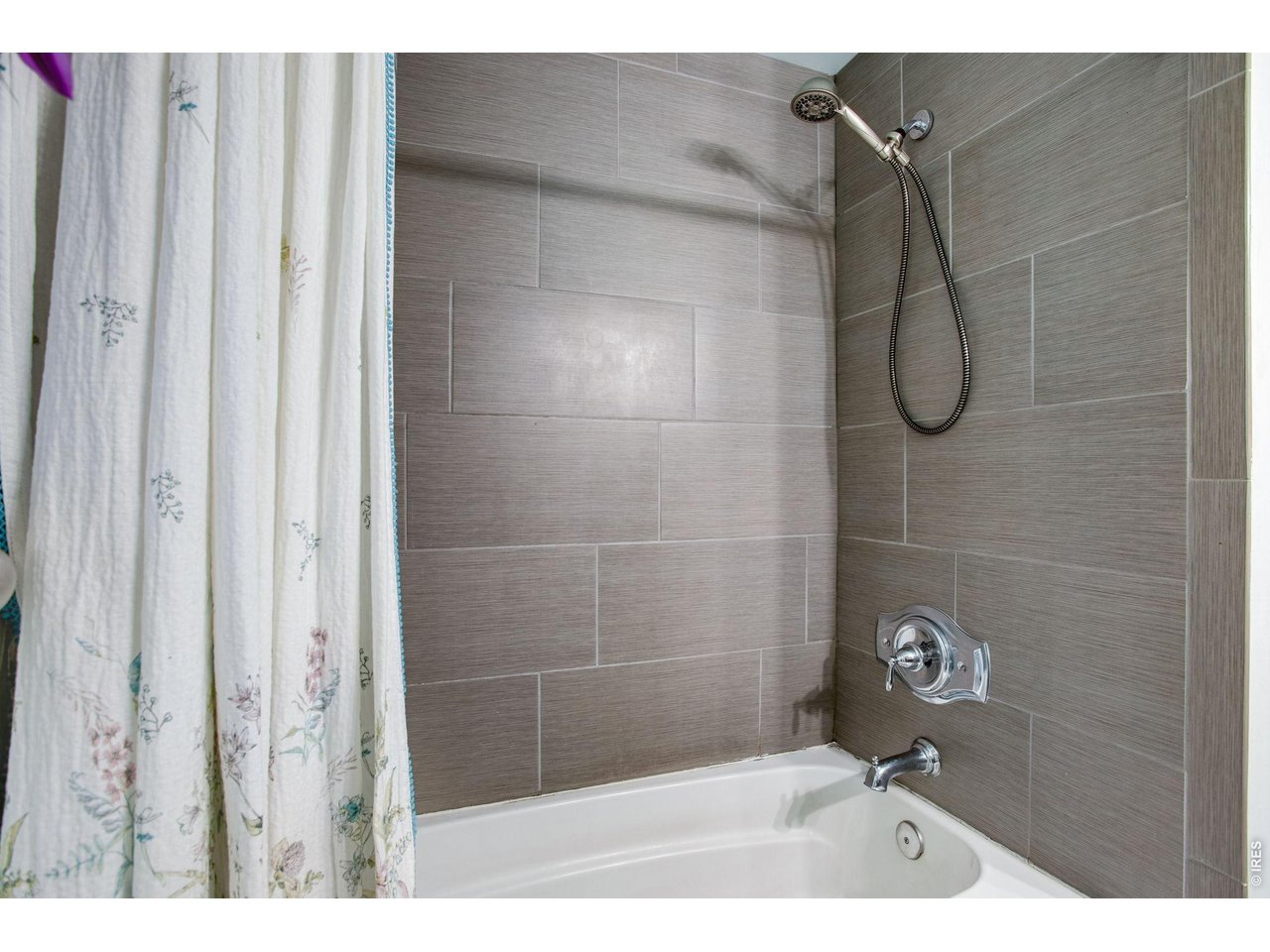 Shared Hall Bath: Surround for the tub and shower has all been updated.