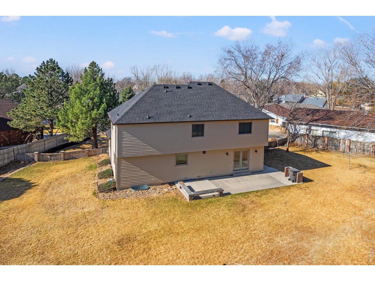 Concrete patio with seating area and built-in grill surround