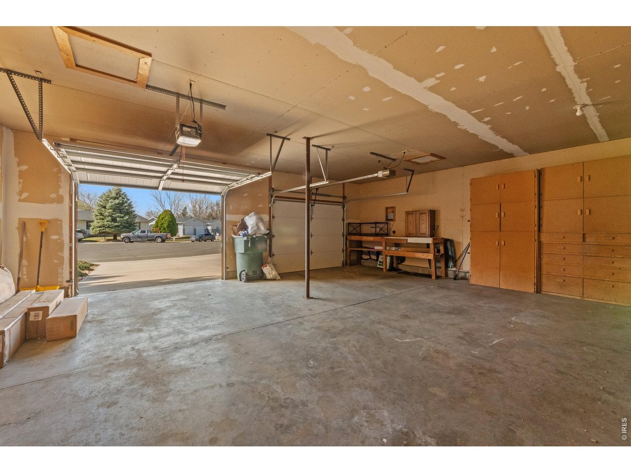 Oversized 2-car garage offering extra space for storage, tools, or hobbies.