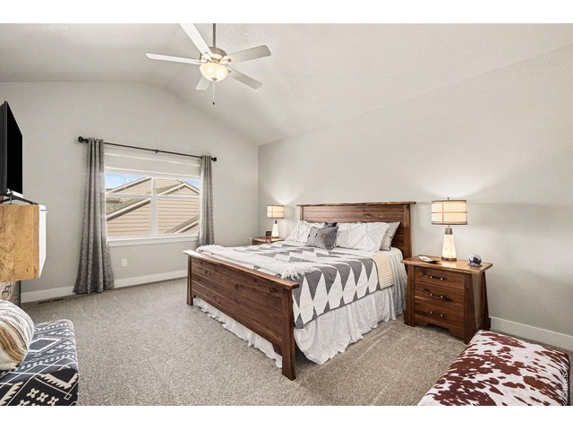 Property Photo 19 Primary bedroom with vaulted ceiling