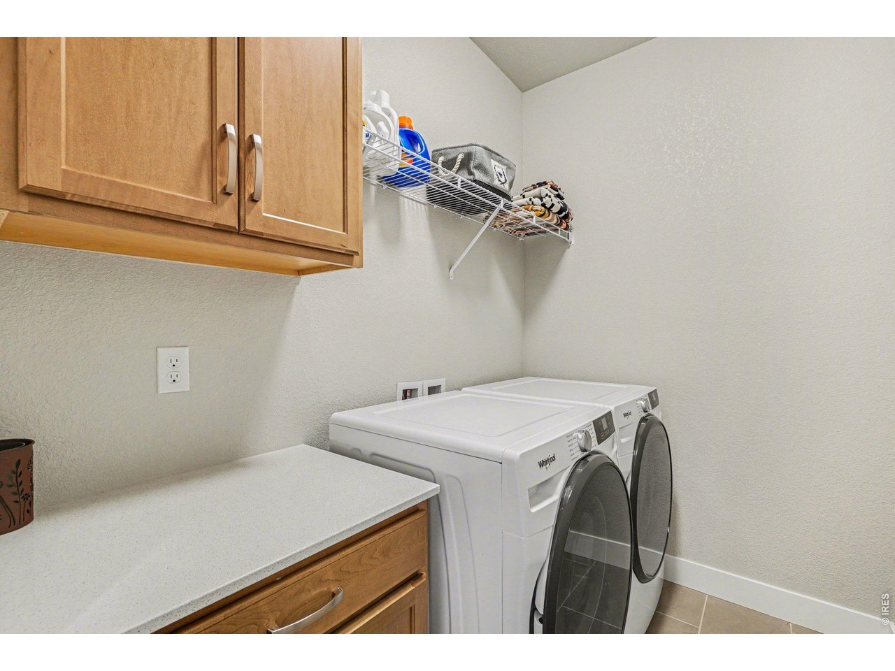 Laundry room with folding counter and cabinetry