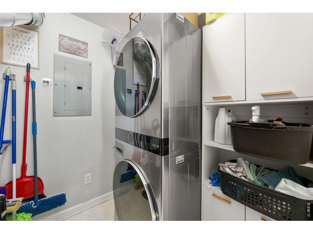 Property Photo 13 Newer washer/dryer set & shelving/cabinets stay