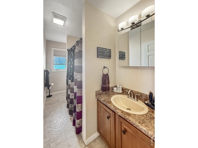Property Photo 9 Primary Level Bathroom