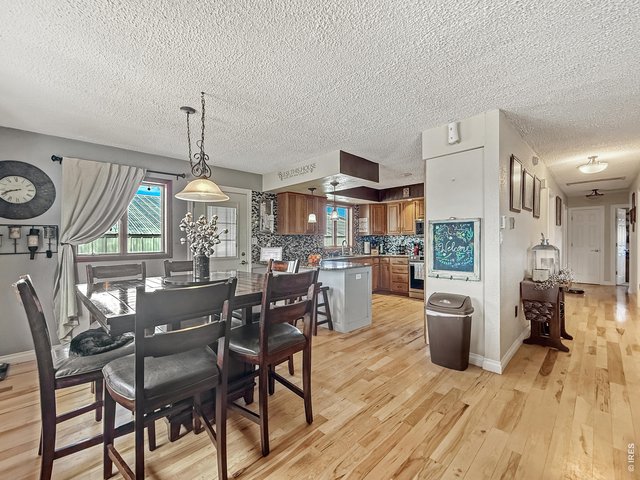 Property Photo 6 Dining Area with Genuine Hardwoods