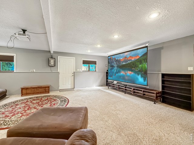 Property Photo 23 Basement Entertainment Room Big Screen!