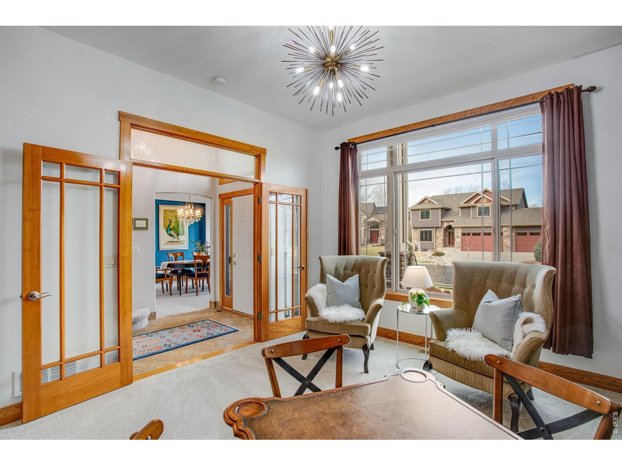 Main Level Office or lounge- French Doors with dual sided fireplace or hearth room.