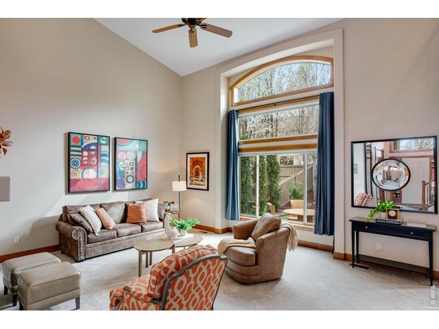 Property Photo 16 Floor to ceiling windows on the south side an abundance of natural daylight in the main level living area. 