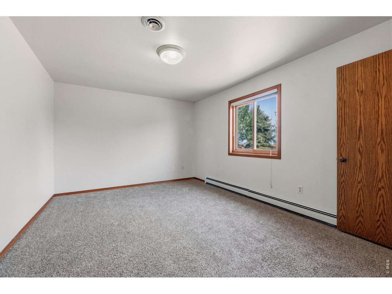 Comfortable upper-level bedroom with a clean, functional layout.