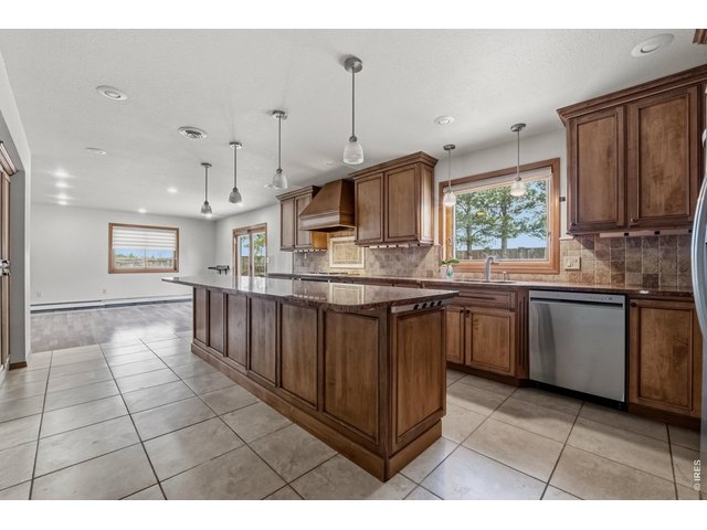Property Photo 13 Chef's kitchen with a large island, granite countertops, and plenty of space to gather.