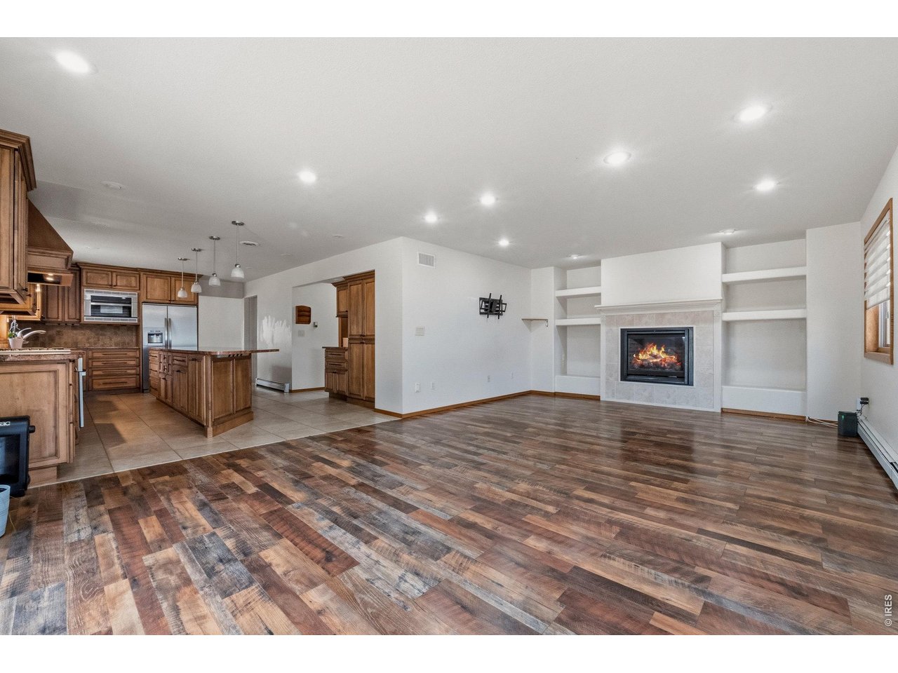 Open-concept living area with seamless flow to the kitchen and easy access to the backyard... perfect for entertaining.