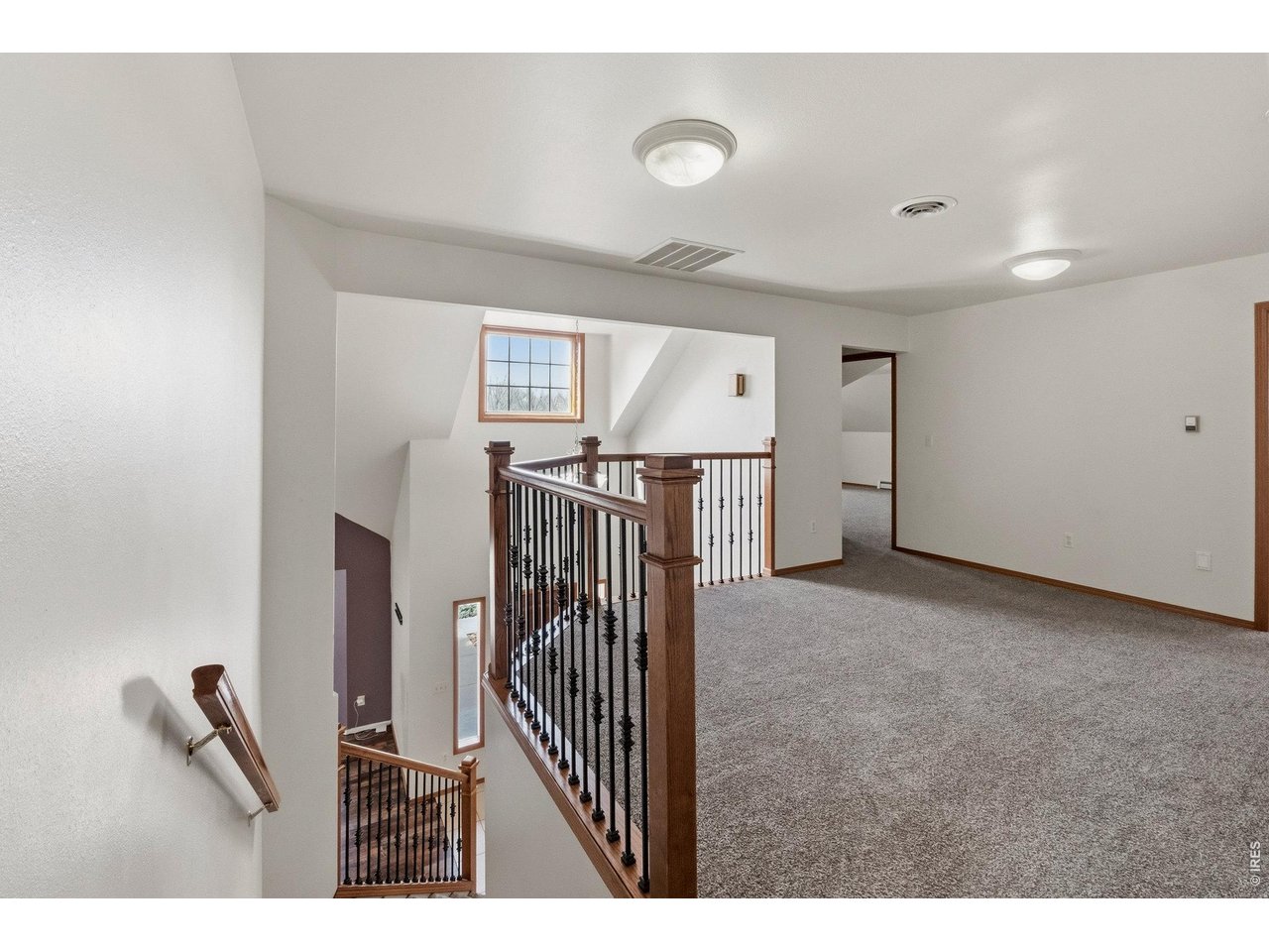 Spacious loft offering flexible use as a second living area, office, or play space.