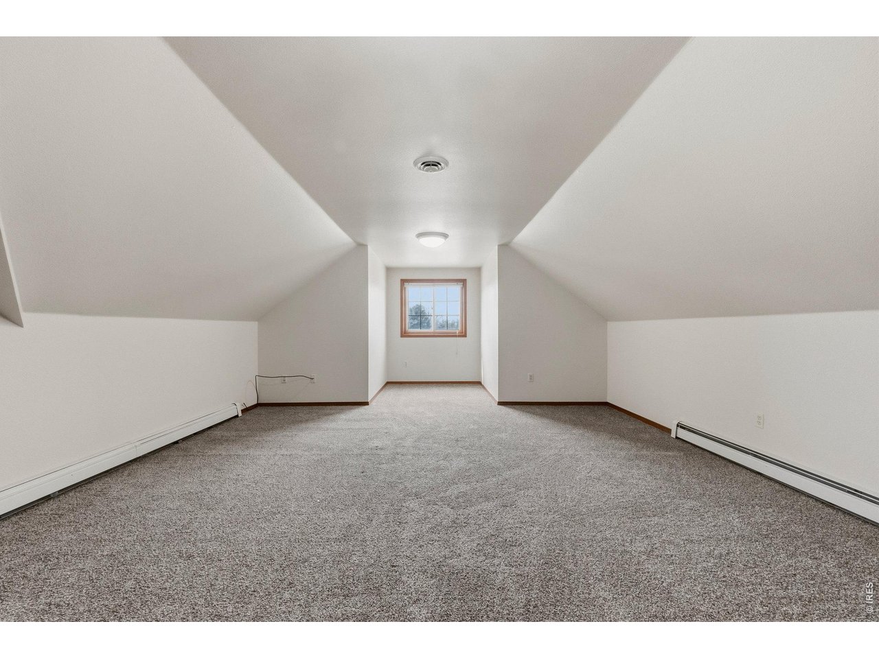 Large upper-level bedroom with plenty of space and comfort.