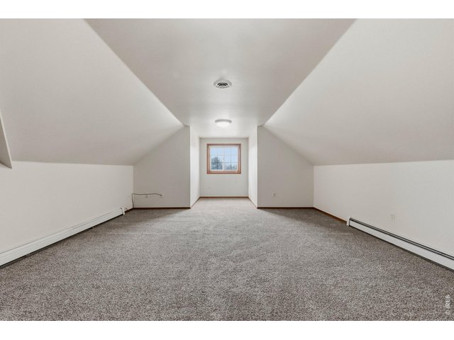Property Photo 25 Large upper-level bedroom with plenty of space and comfort.