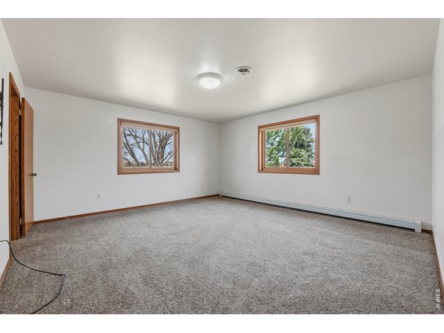 Property Photo 28 Spacious primary bedroom with a walk-in closet and private ensuite bath.