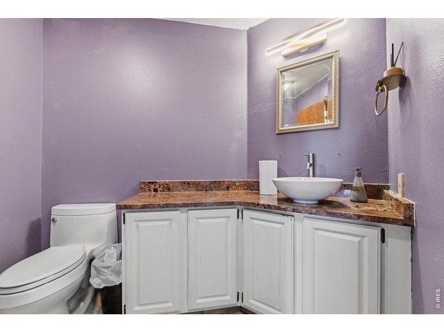 Property Photo 23 Conveniently located half bath on the main level for guests and everyday use.