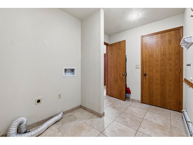 Property Photo 22 Functional laundry/ mud room just off the oversized 2-car garage. Perfect for everyday convenience.