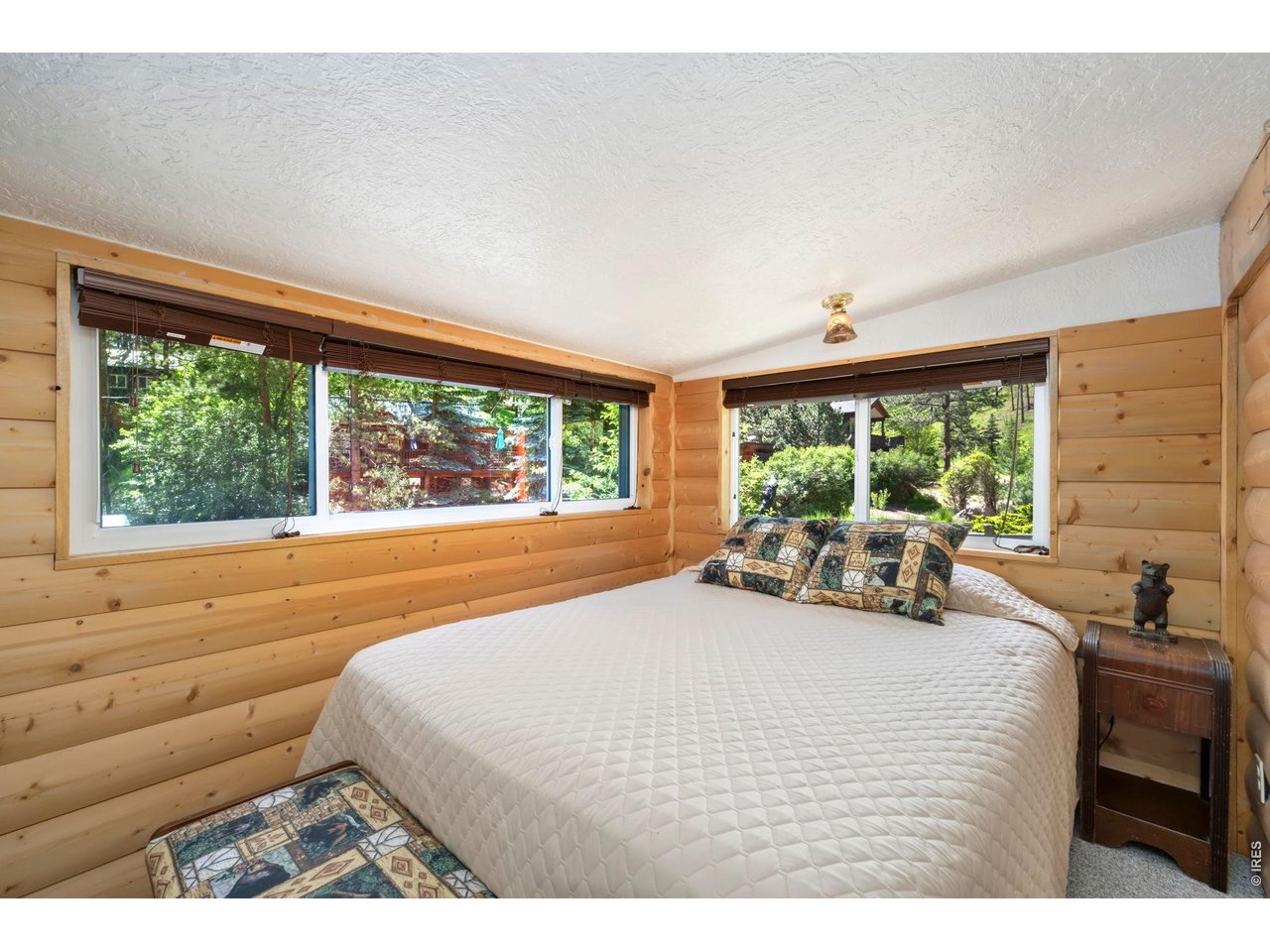 Queen sized bed in bedroom area