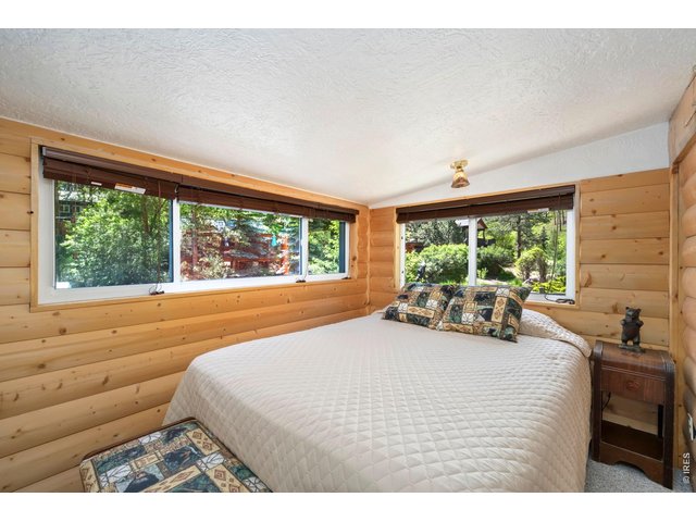 Property Photo 12 Queen sized bed in bedroom area