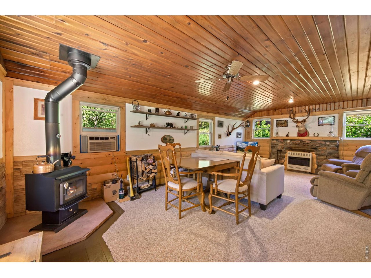 Wood burning stove and wall air conditioner