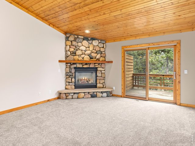 Property Photo 2 Large Living Room with Real River Rock Fireplace