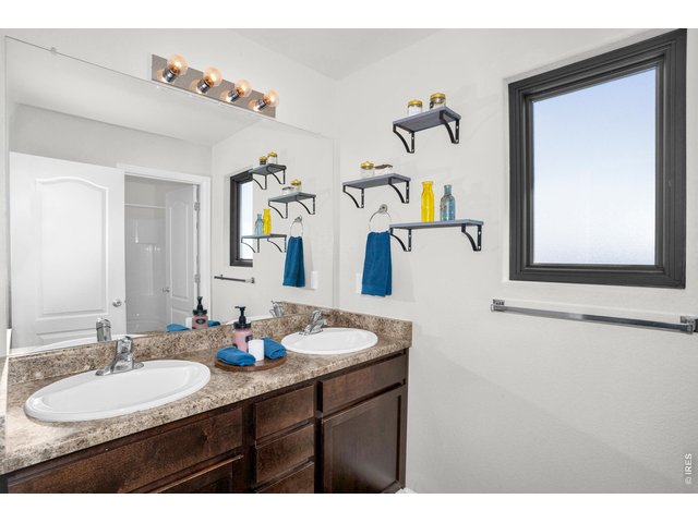 Property Photo 19 2nd full bath upstairs also has dual sinks and..