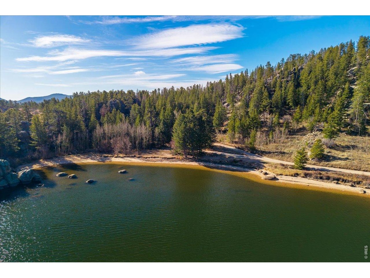 Walk just down the road to a secluded beach/cove behind beautiful rock outcroppings on Hiawatha Lake!