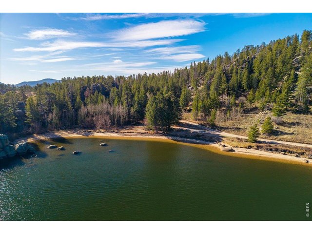 Property Photo 29 Walk just down the road to a secluded beach/cove behind beautiful rock outcroppings on Hiawatha Lake!