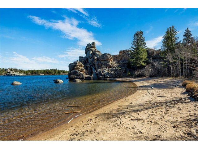 Property Photo 30 Walk just down the road to a secluded beach/cove behind beautiful rock outcroppings on Hiawatha Lake!
