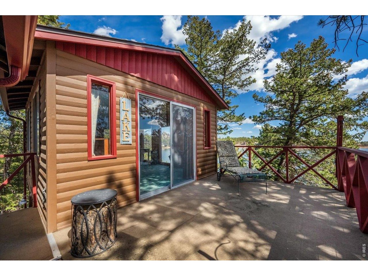 Entry to detached sleeping area #1 with outdoor porch perfect for taking in the lake views