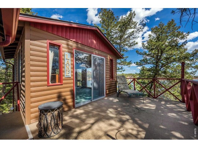 Property Photo 22 Entry to detached sleeping area #1 with outdoor porch perfect for taking in the lake views